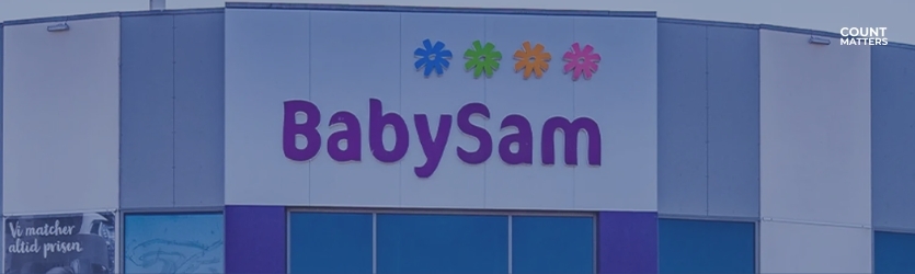 Fasade av BabySam-butikk med fargerik logo. Perfekt illustrasjon for fotfallanalyse, persontelling og optimalisering av kundeopplevelsen i retail med CountMatters, logo i hjørnet.